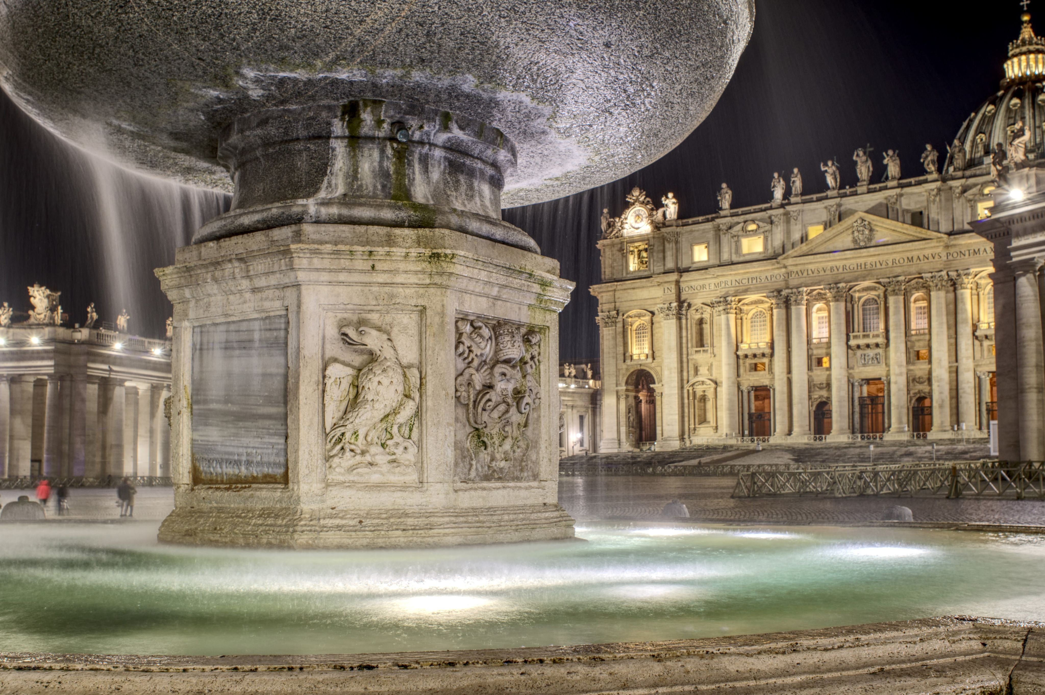 Foundtain on St. Peter's Square at night