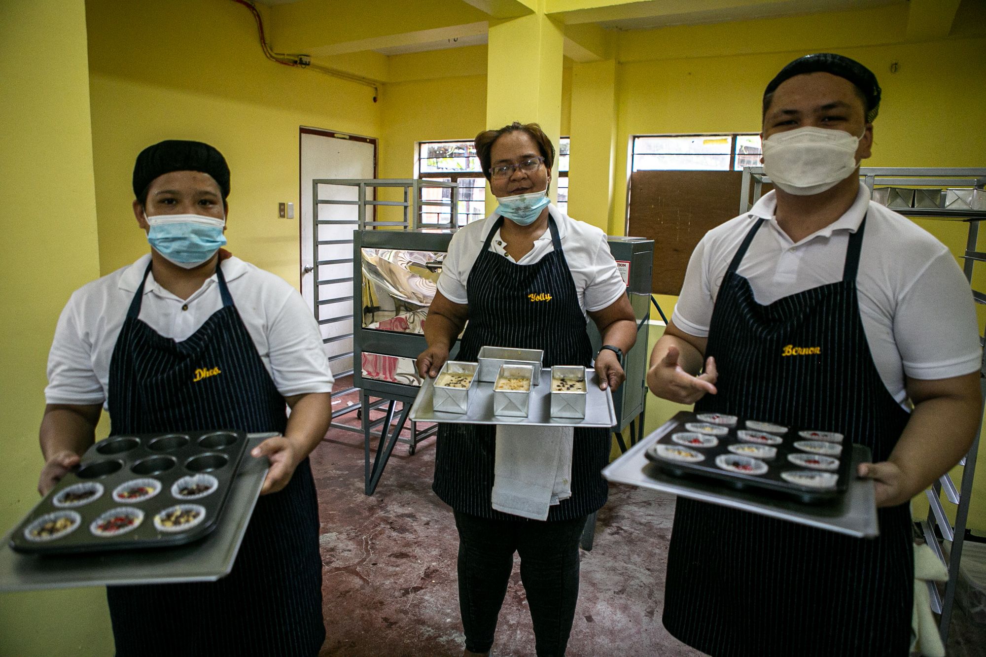 Yolanda Gutierrez (center) and other homeless people pose for the camera during the skills training course conducted by the Arnold Janssen Kalinga Foundation.