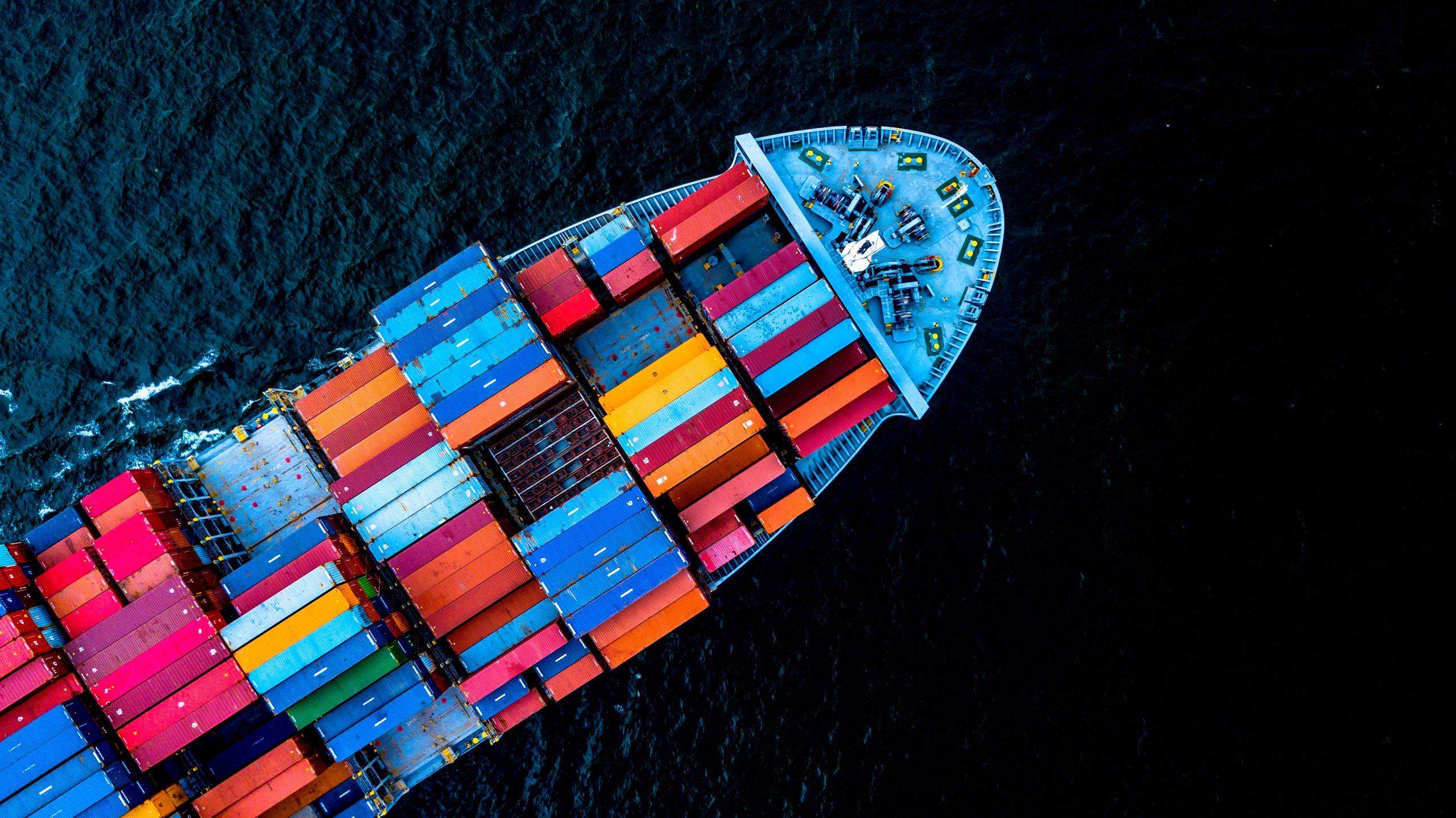 Aerial top view container cargo ship in import export business logistic and transportation of international by container cargo ship in the open sea, with copy space.
