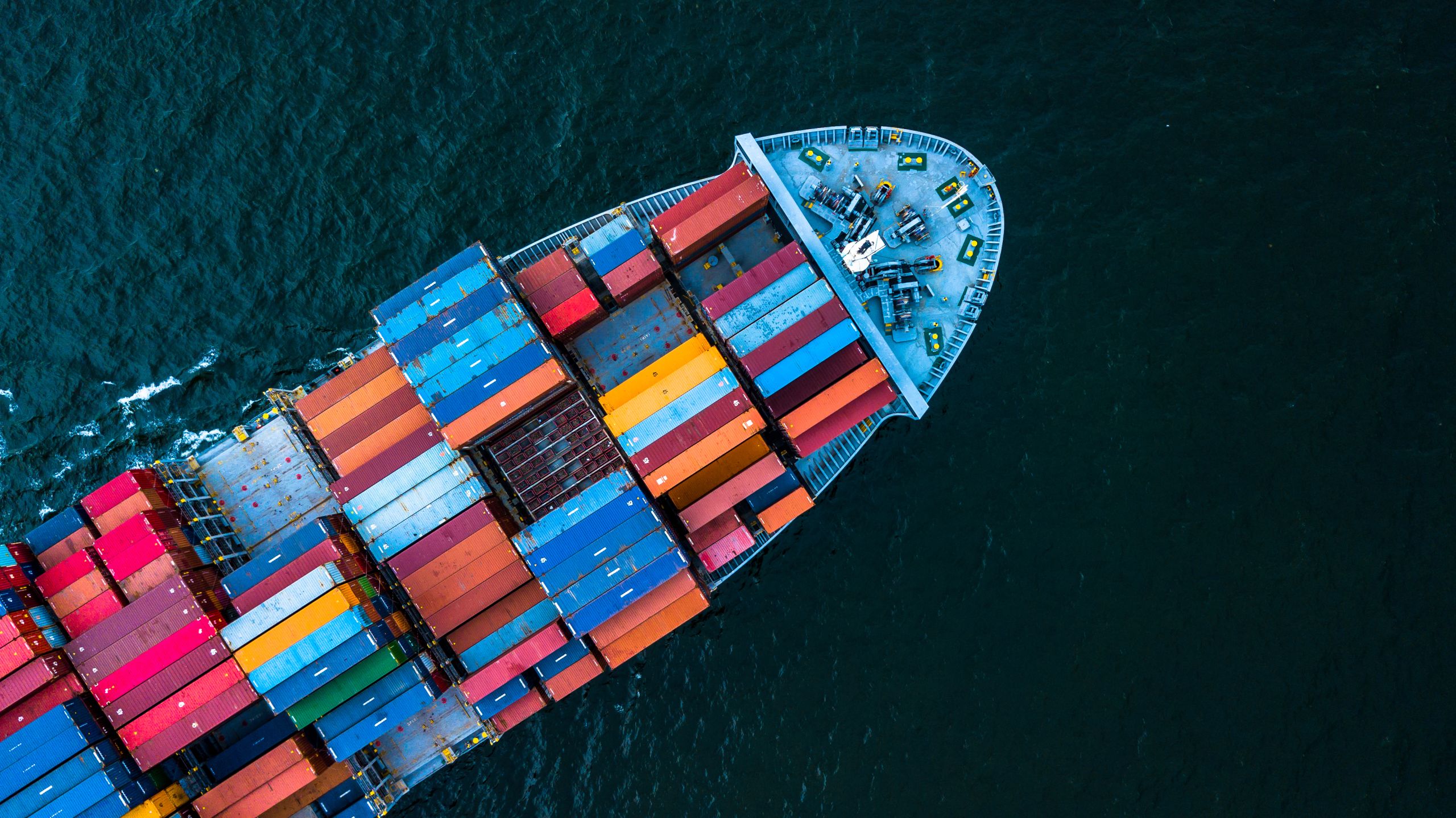Aerial top view container cargo ship in import export business logistic and transportation of international by container cargo ship in the open sea, with copy space.