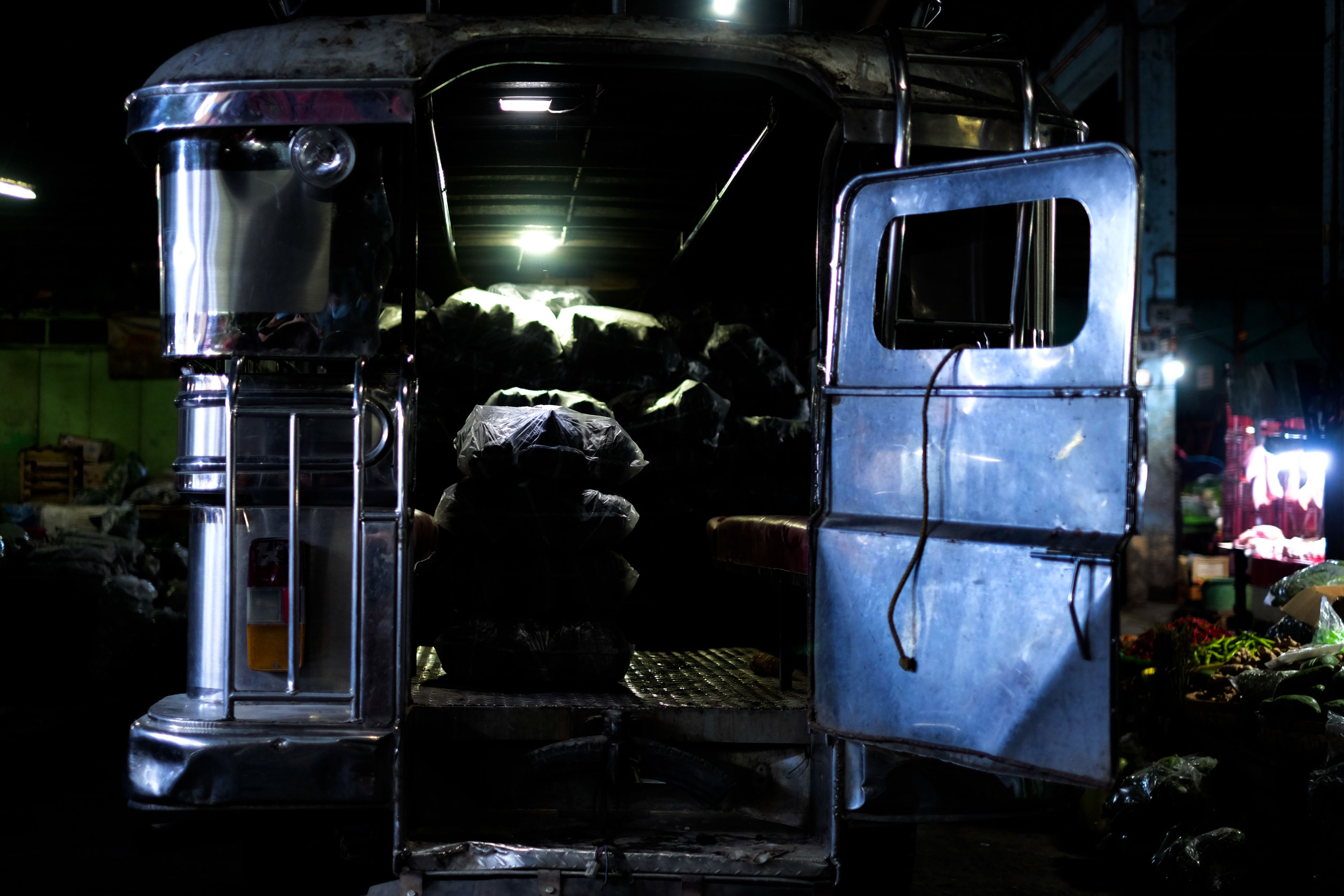The back of a Jeepney at night