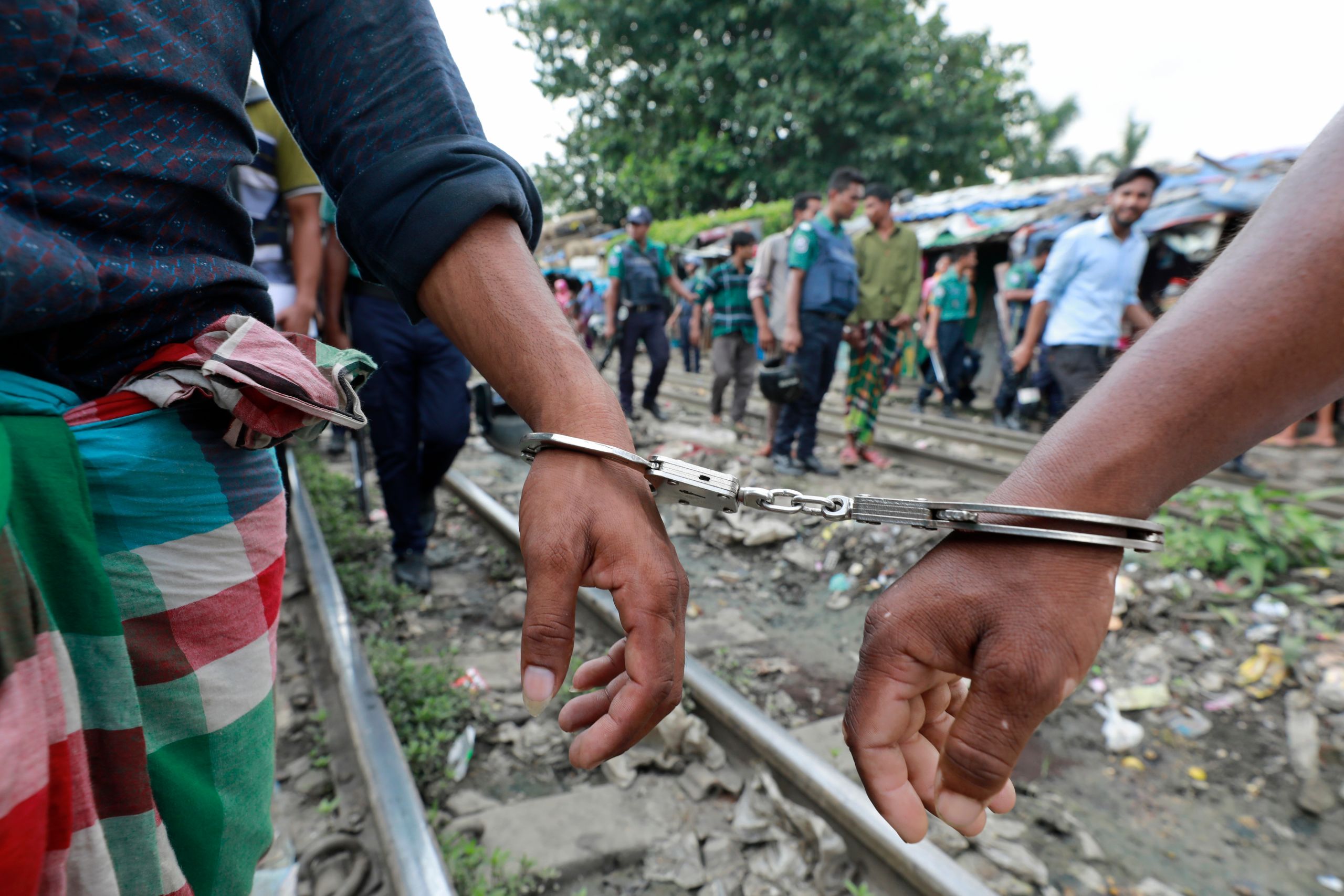 Suspects detained during a police anti-drug operation in a slum area of Dhaka, Bangladesh