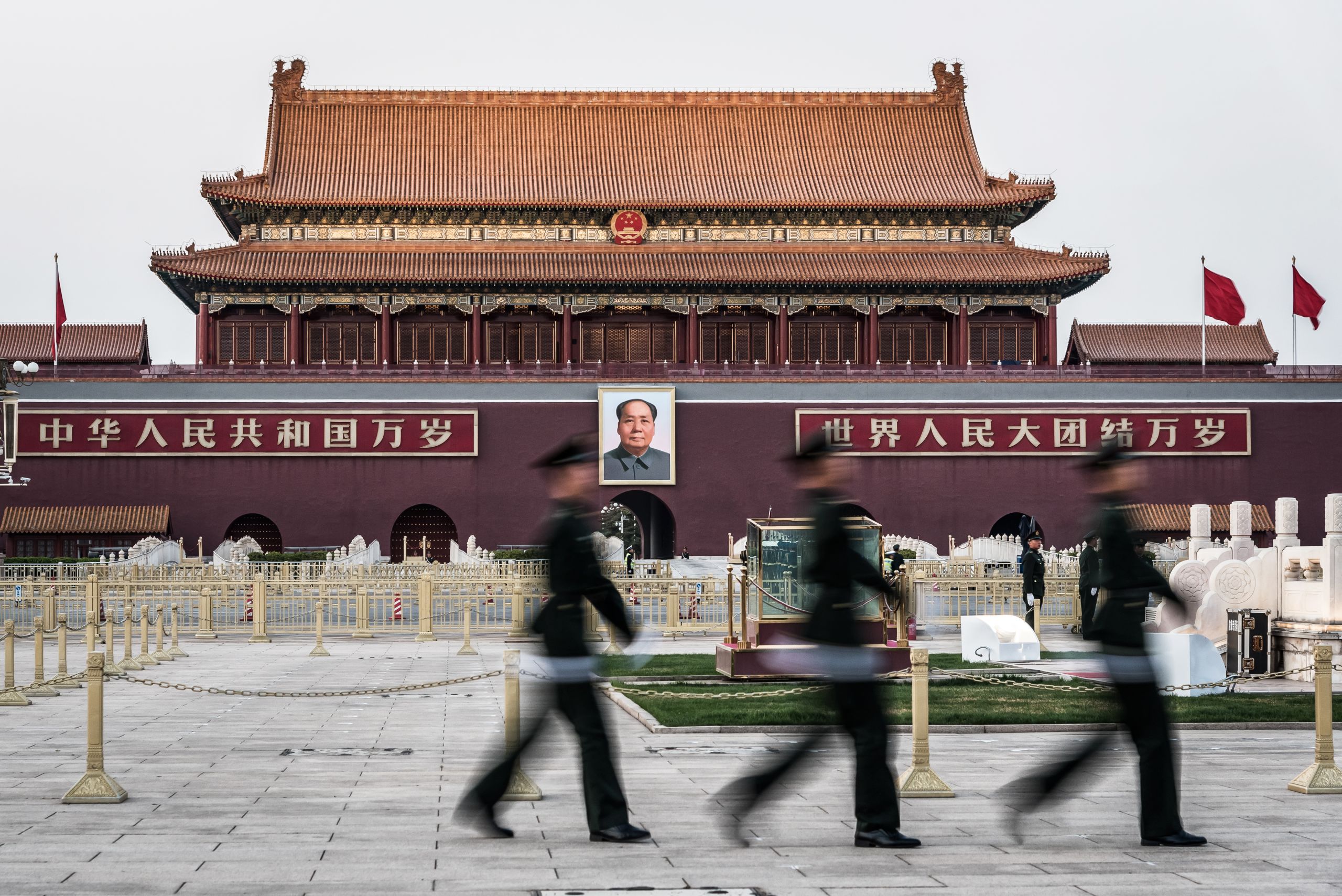 Guards walking in front of a giant portrait of Mao Zedong on the Heavenly Gate to the Forbidden City, Tiananmen Square, Beijing, on March 27, 2019. (shutterstock.com photo) 