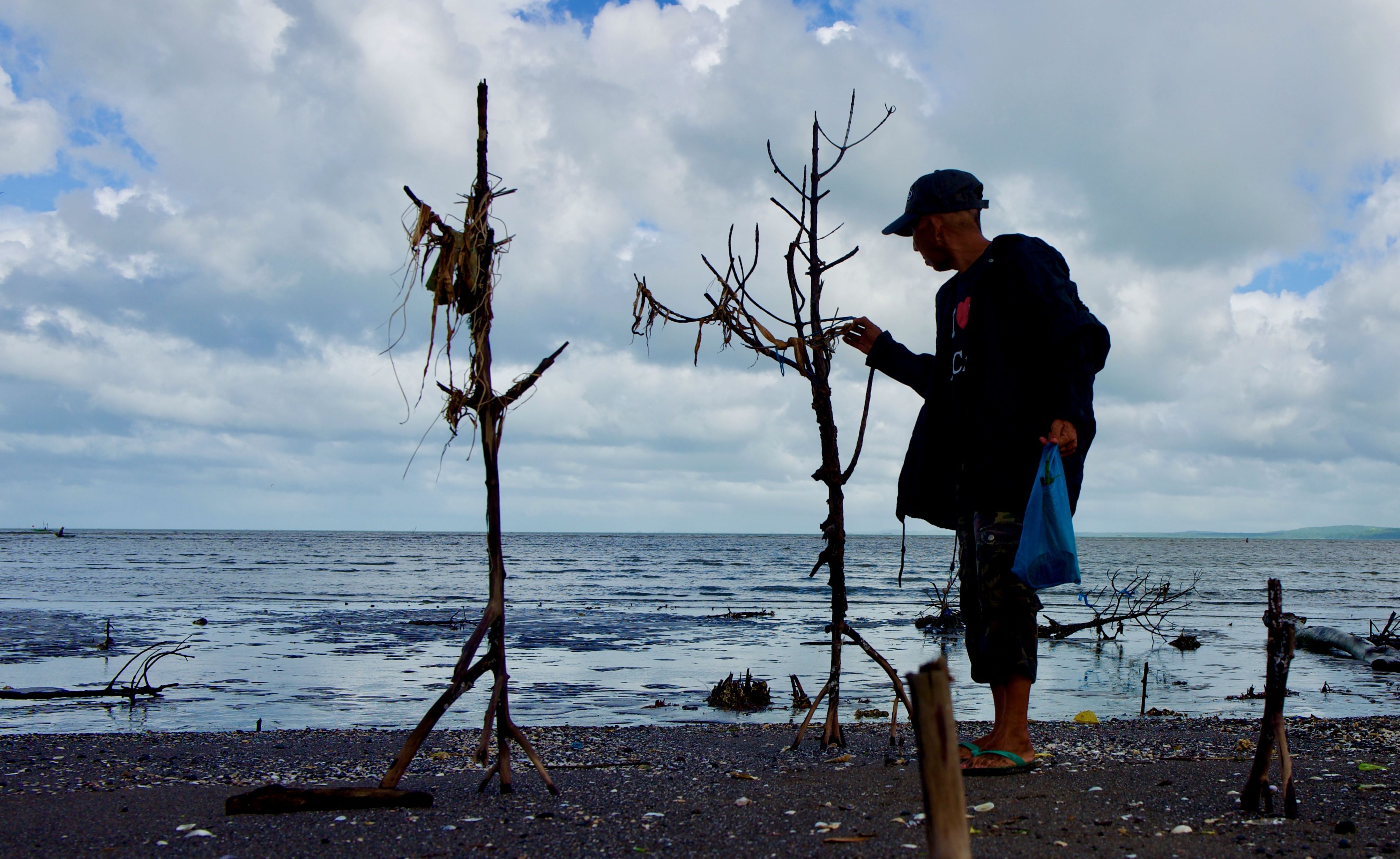 Ramon Sta. Ana starts and ends his day checking the mangrove forest.