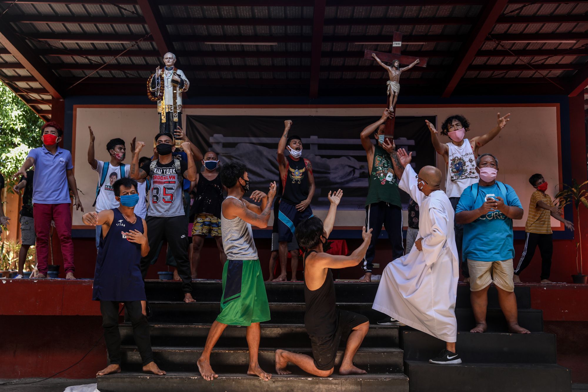 Performers sing and dance on stage during the closing part of the play at the Paco Catholic School in Manila.