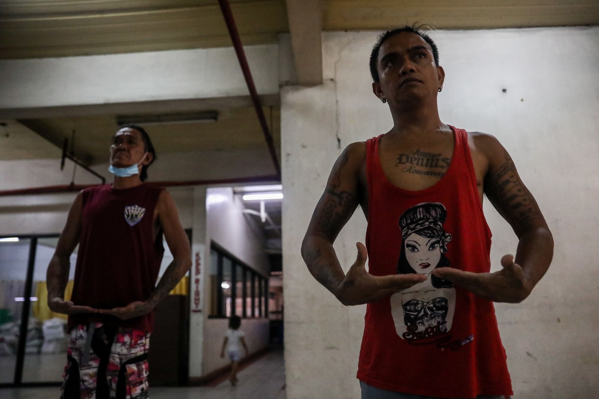 Homeless people dance during a theater arts practice at the Paco Catholic School in Manila, Philippines.