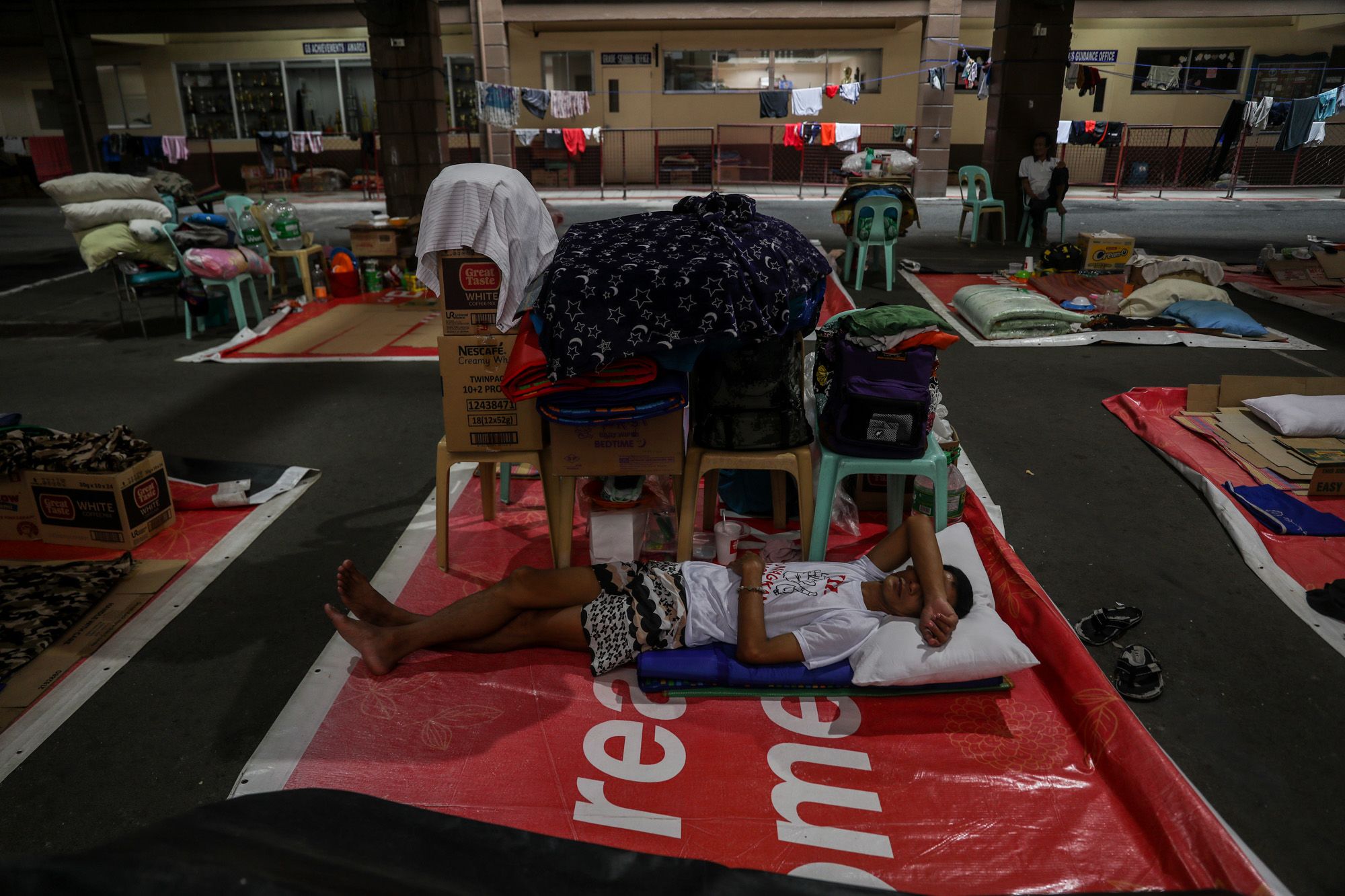 A man sleeps at the Paco Catholic School, which has been used as a shelter for the homeless, in Manila, Philippines.