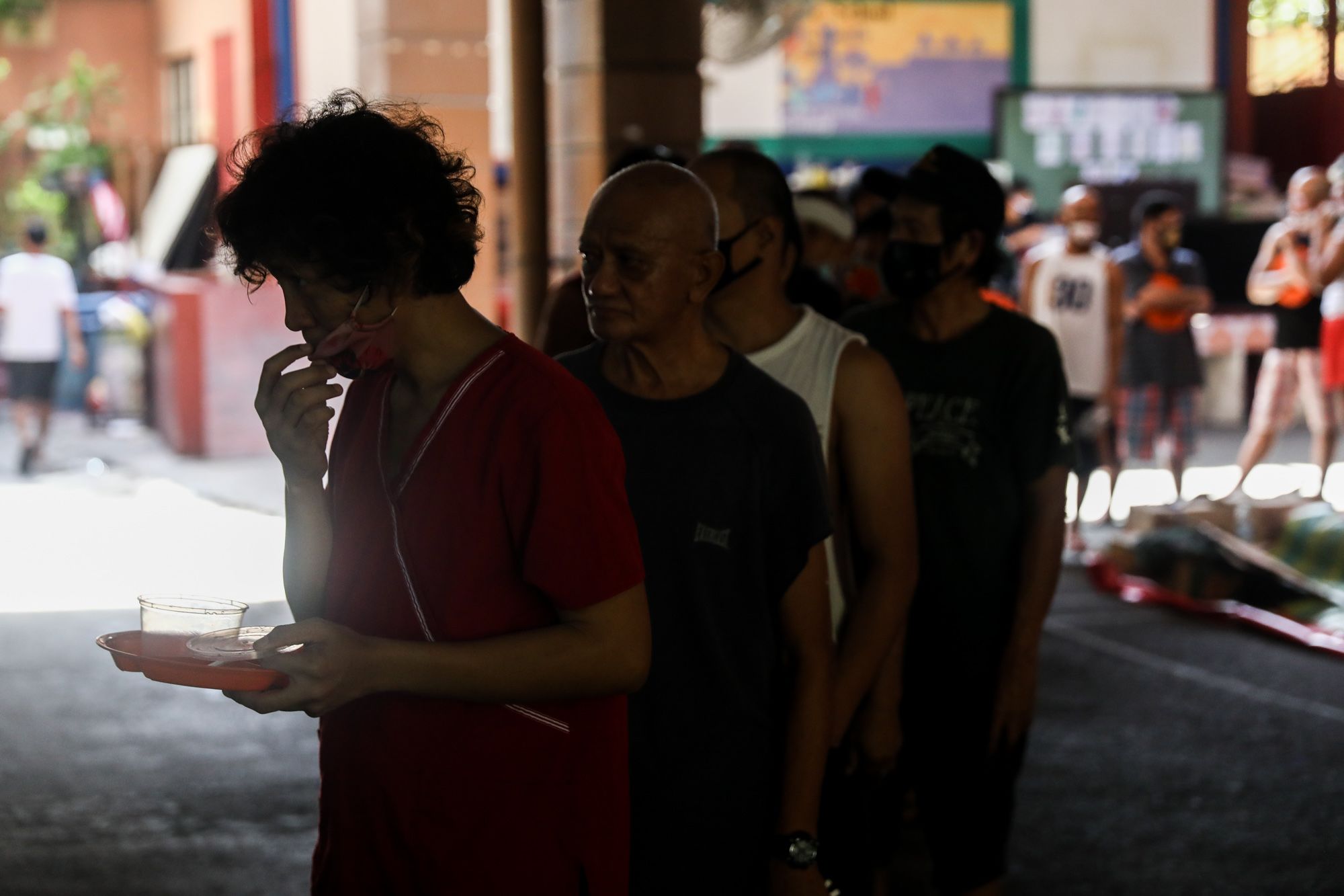 Roland Sanlao and cast of the play fall in line for lunch break during the theater arts workshop inside the Paco Catholic School in Manila, Philippines.
