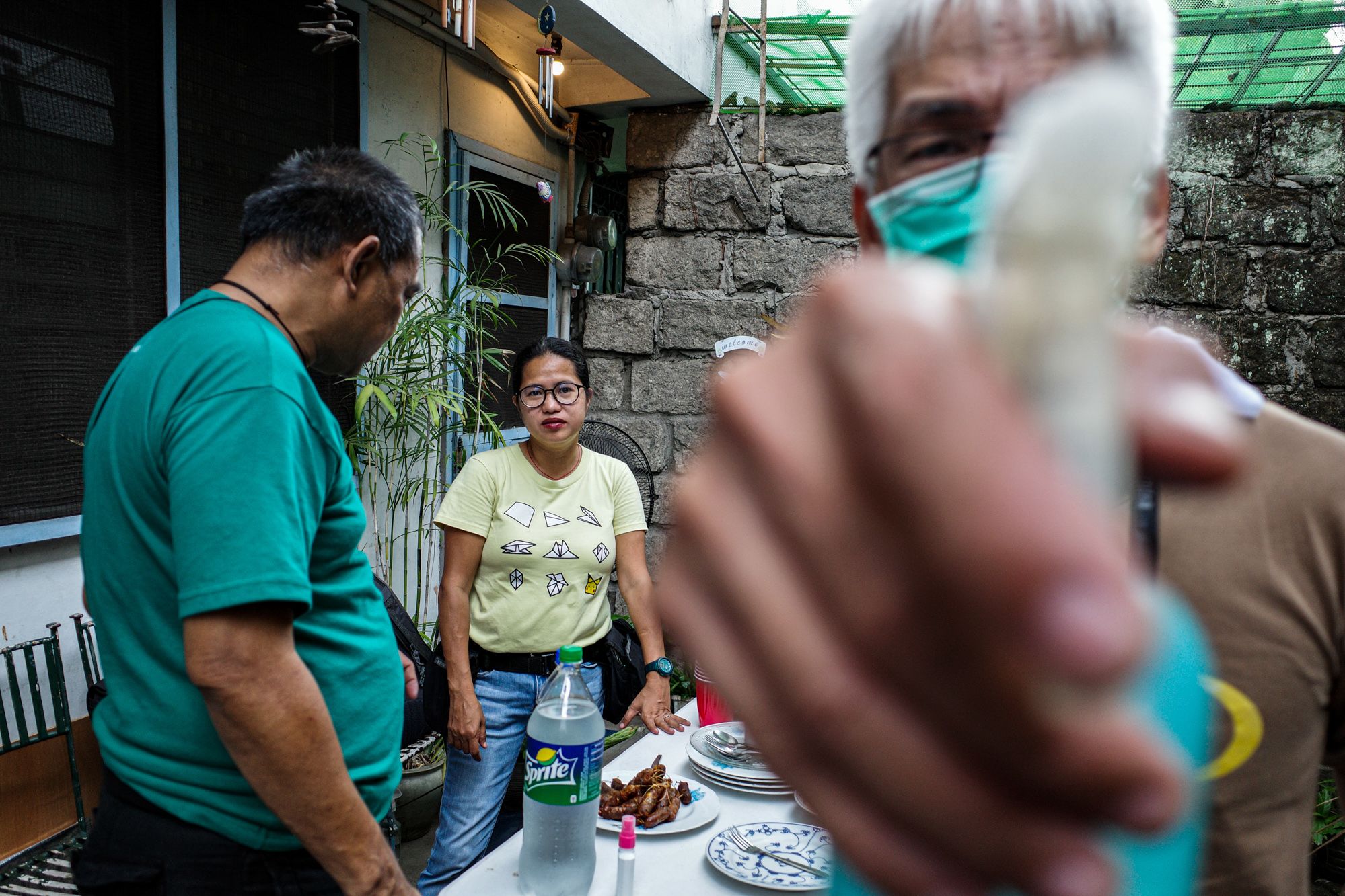 Photojournalists Angie de Silva, Maria Tan, and Gerard Carreon prepare to take their first meal of the day. (Photo by Mark Saludes)