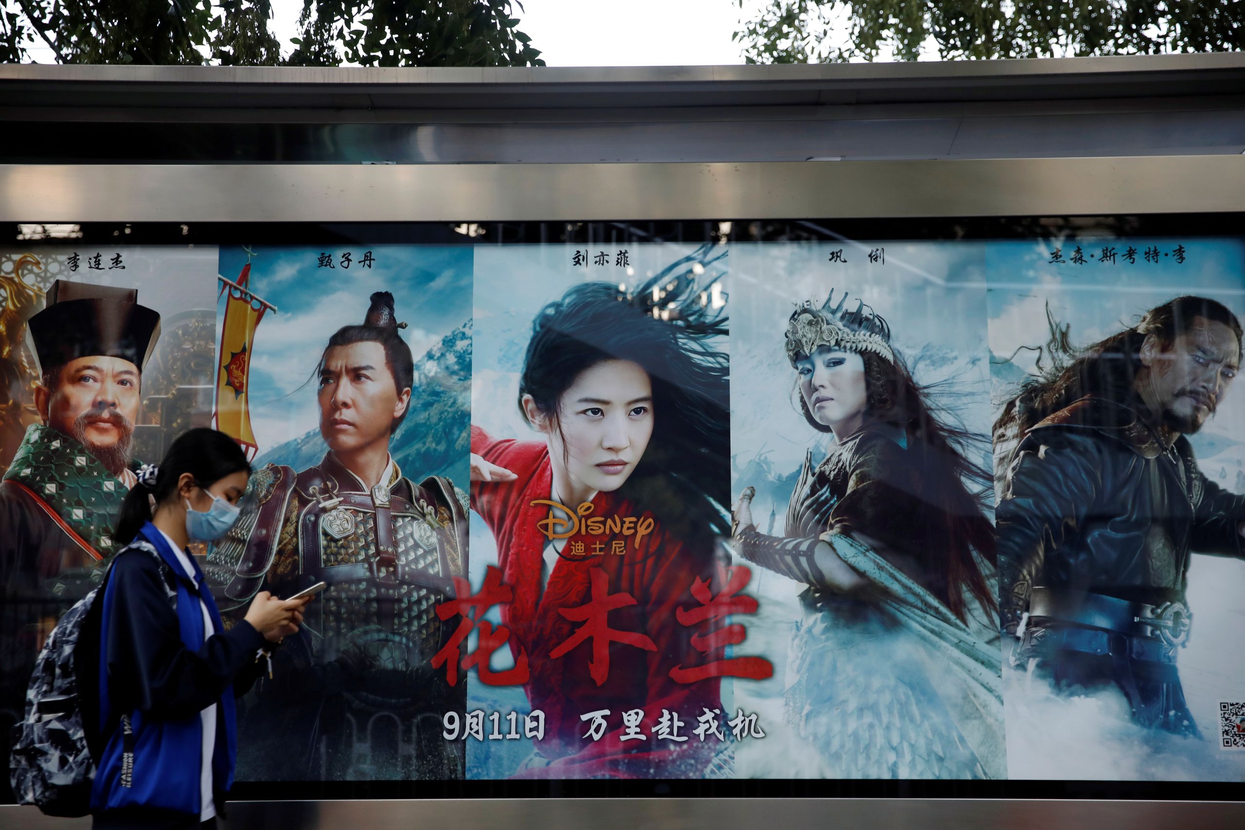 Advertisement promoting Disney's movie "Mulan" at a bus stop in Beijing