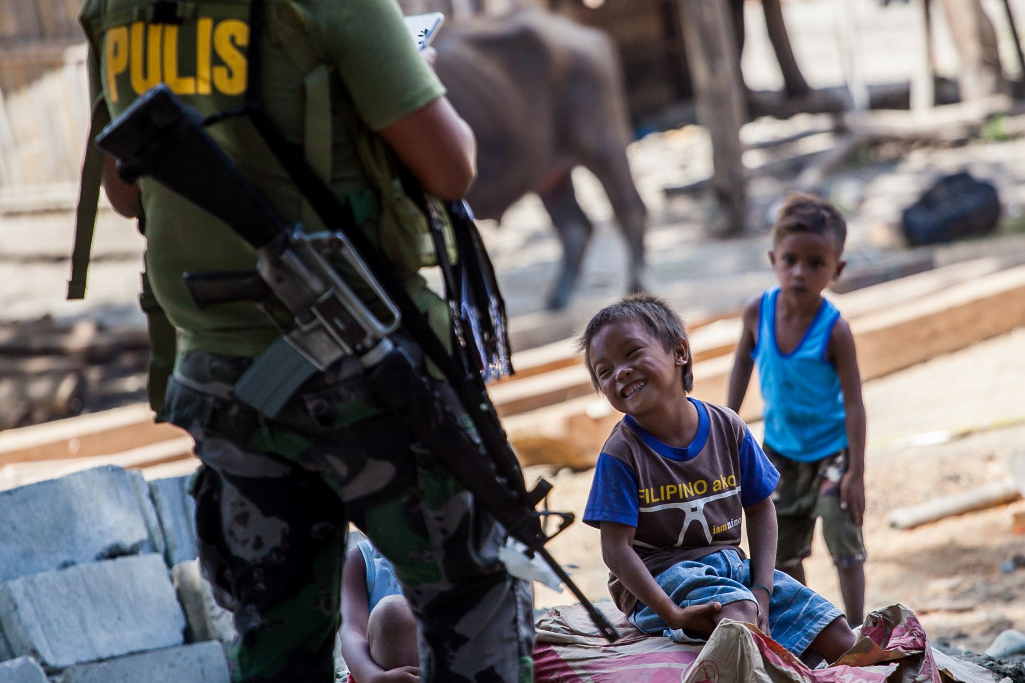 A police officer plays with children in Cagayan province in the northern Philippines in this photo taken in 2019.
