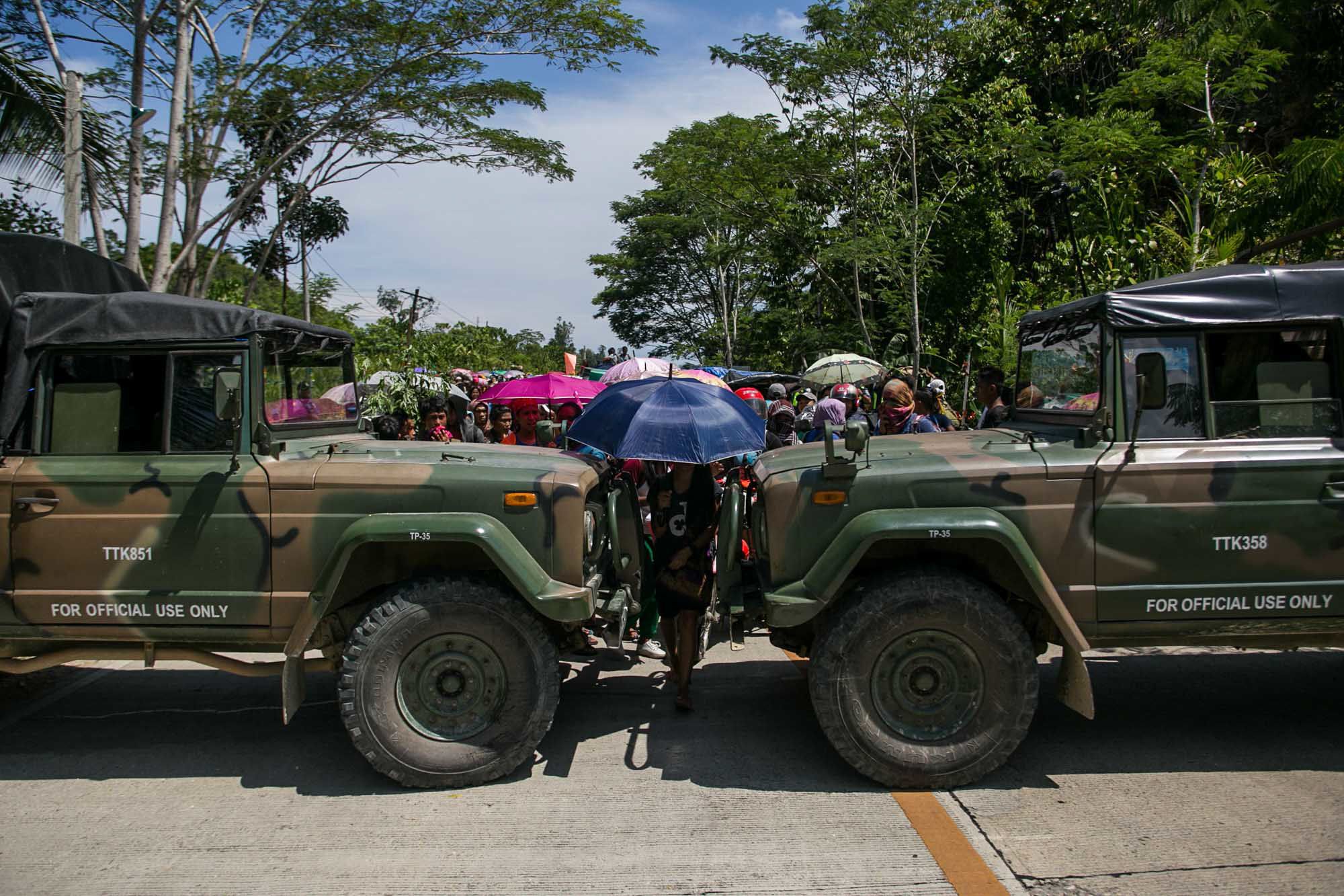 Philippine Army soldiers barricade the road to prevent the exodus of at least 1,600 tribal people who fled their village due to military operations in this photograph taken in 2018 in Mindanao.