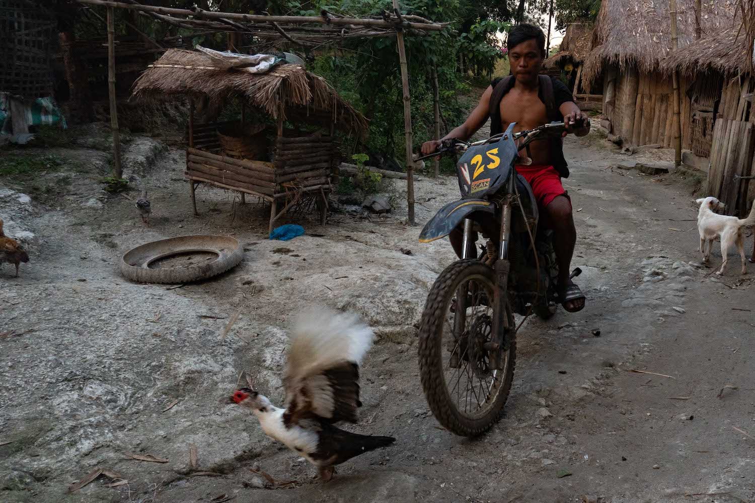 An Aeta man on a motorbike