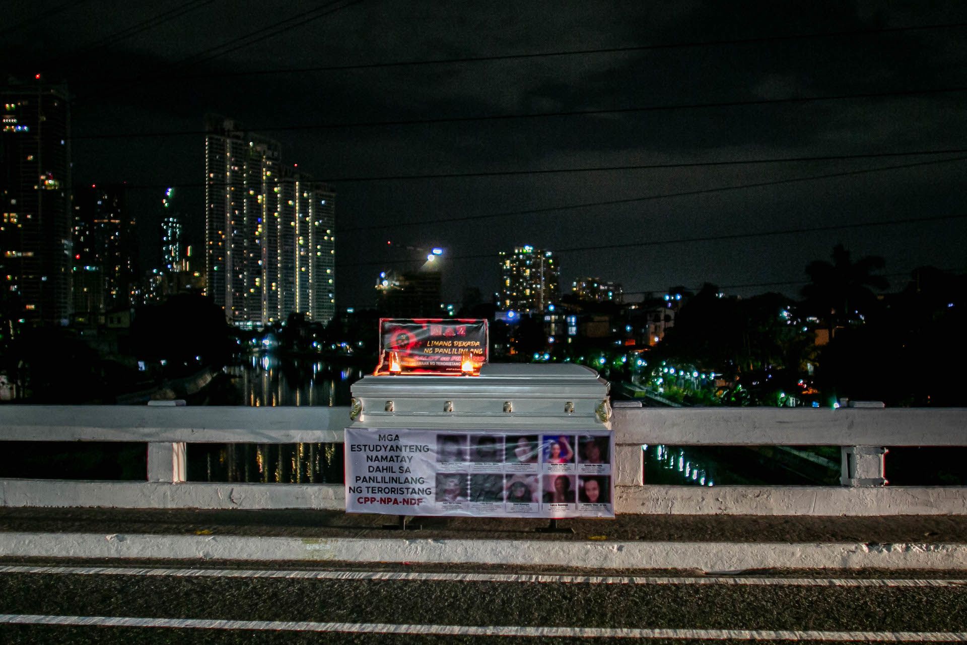 Coffins with anti-communist slogans are placed on a busy avenue in the Philippines