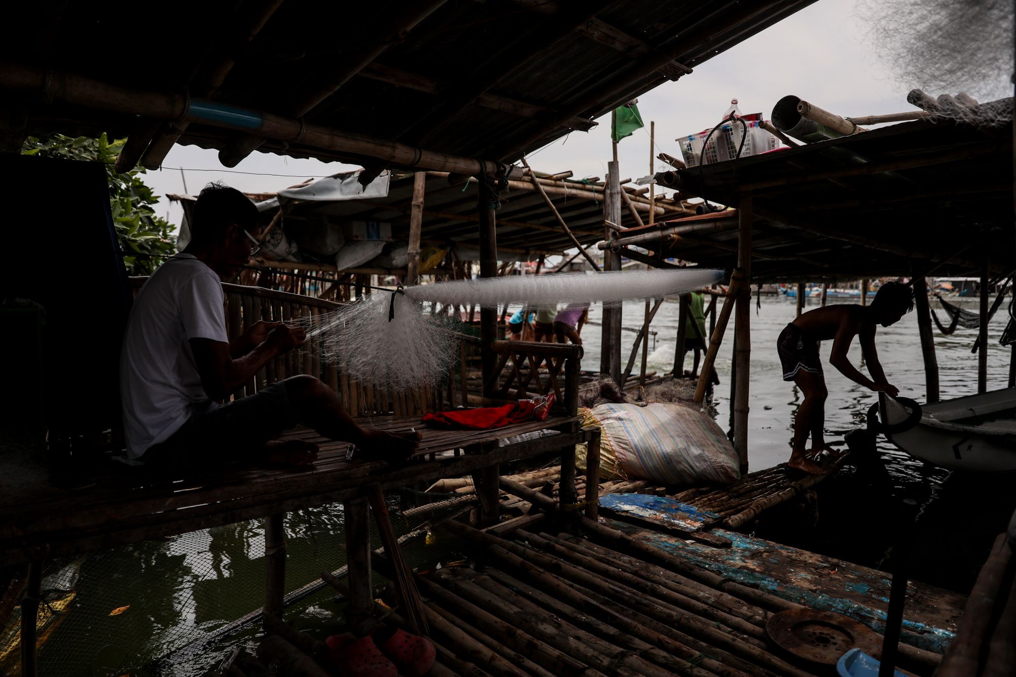 Fishermen prepare to fish near the coastal village of Tibaguin, Philippines