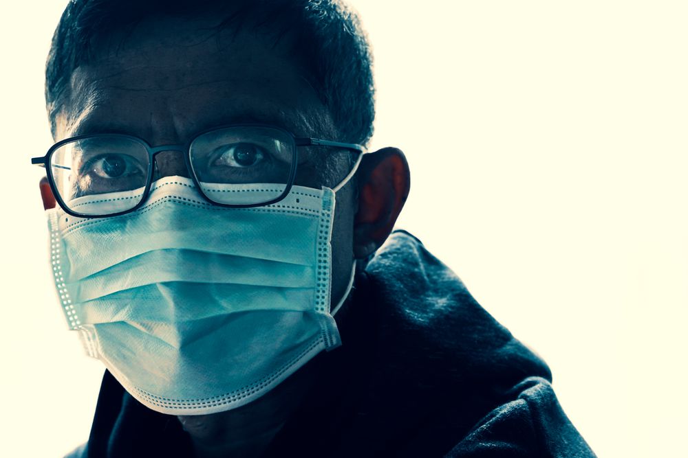 Stressed patient wearing face mask